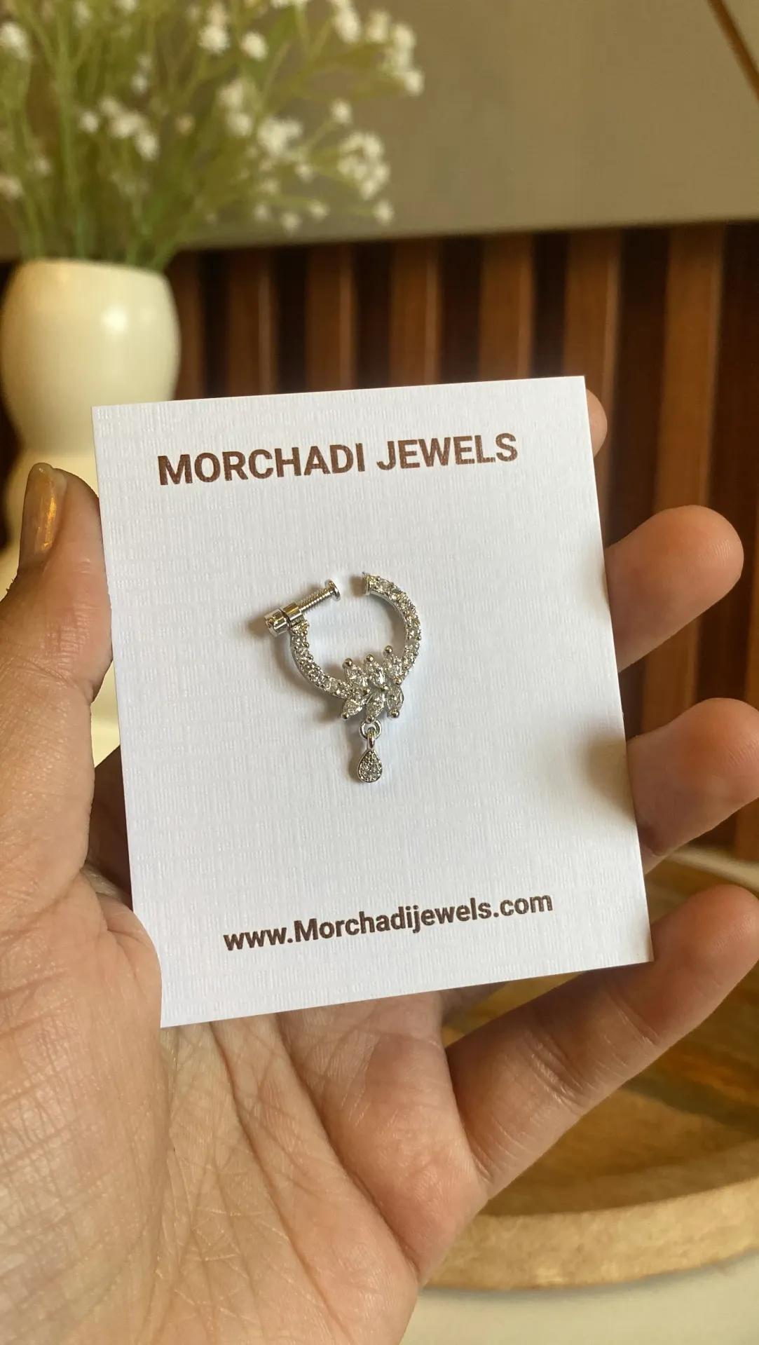 Silver-tone nose ring opening into a spray of marquise stones with a pave teardrop below