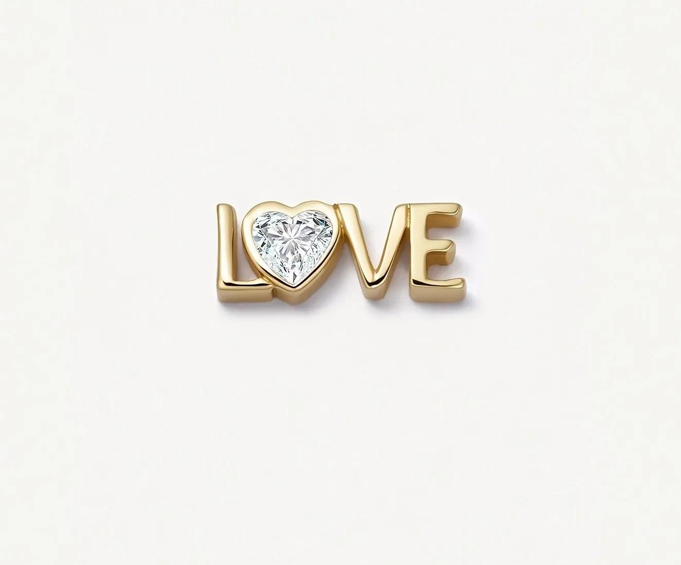 Gold-plated charm spelling LOVE with a clear heart-shaped stone in place of the letter O
