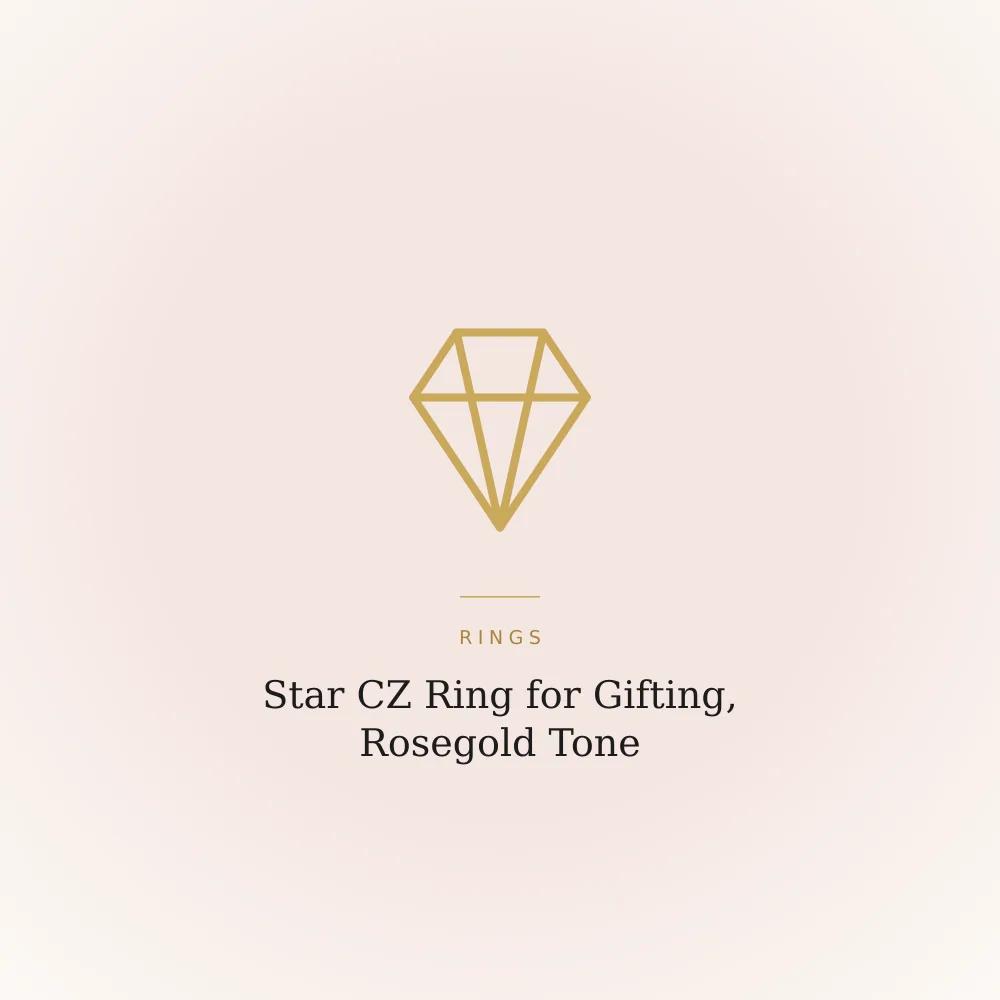 Star-shaped ring in rosegold tone with cubic zirconia stones, shown on a plain card