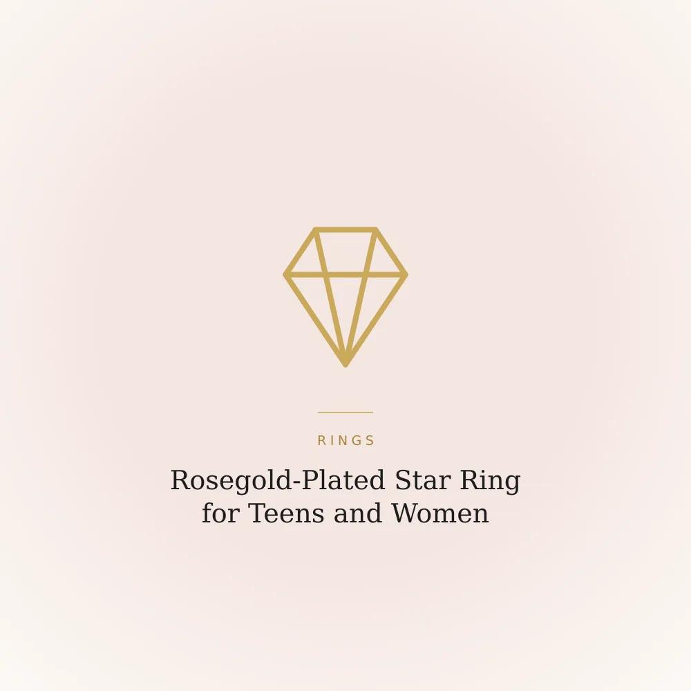 Rosegold-plated star ring with cubic zirconia stones, close-up on a plain background