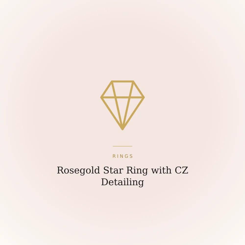 Rosegold star ring detailed with cubic zirconia stones, catching light against a plain backdrop