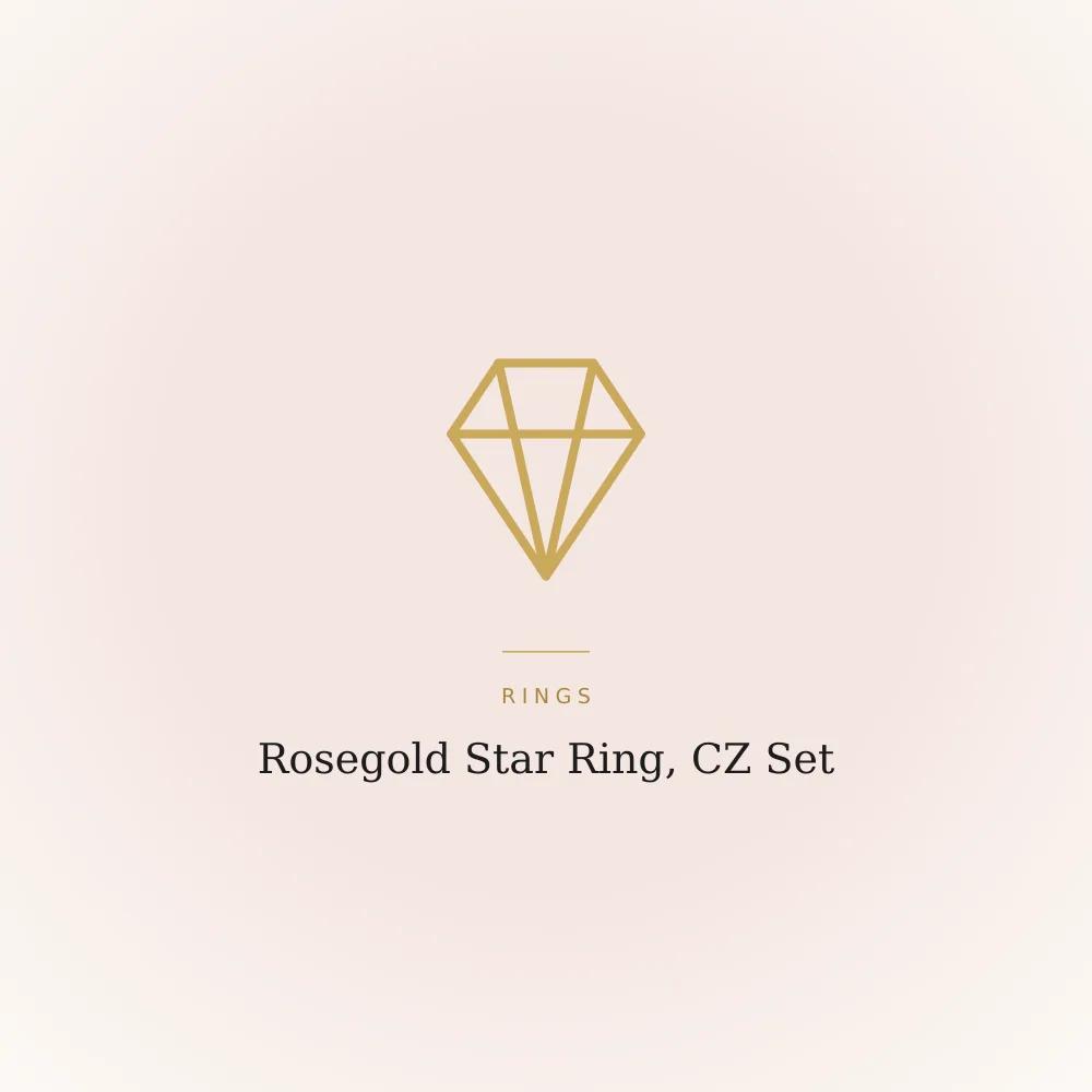 Rosegold-plated star ring set with cubic zirconia stones on a plain surface