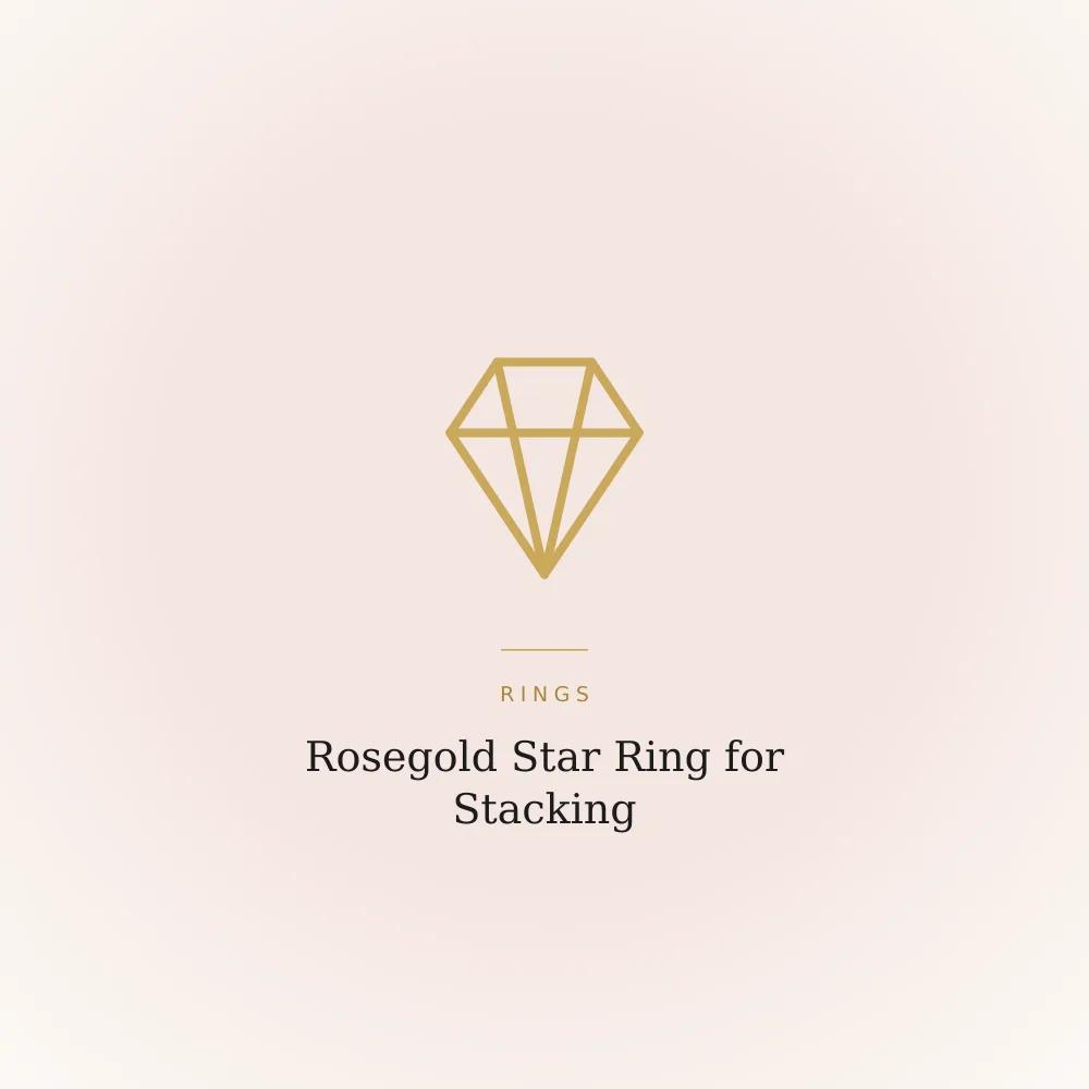 Rosegold-plated star ring with cubic zirconia, shown worn alongside other rings