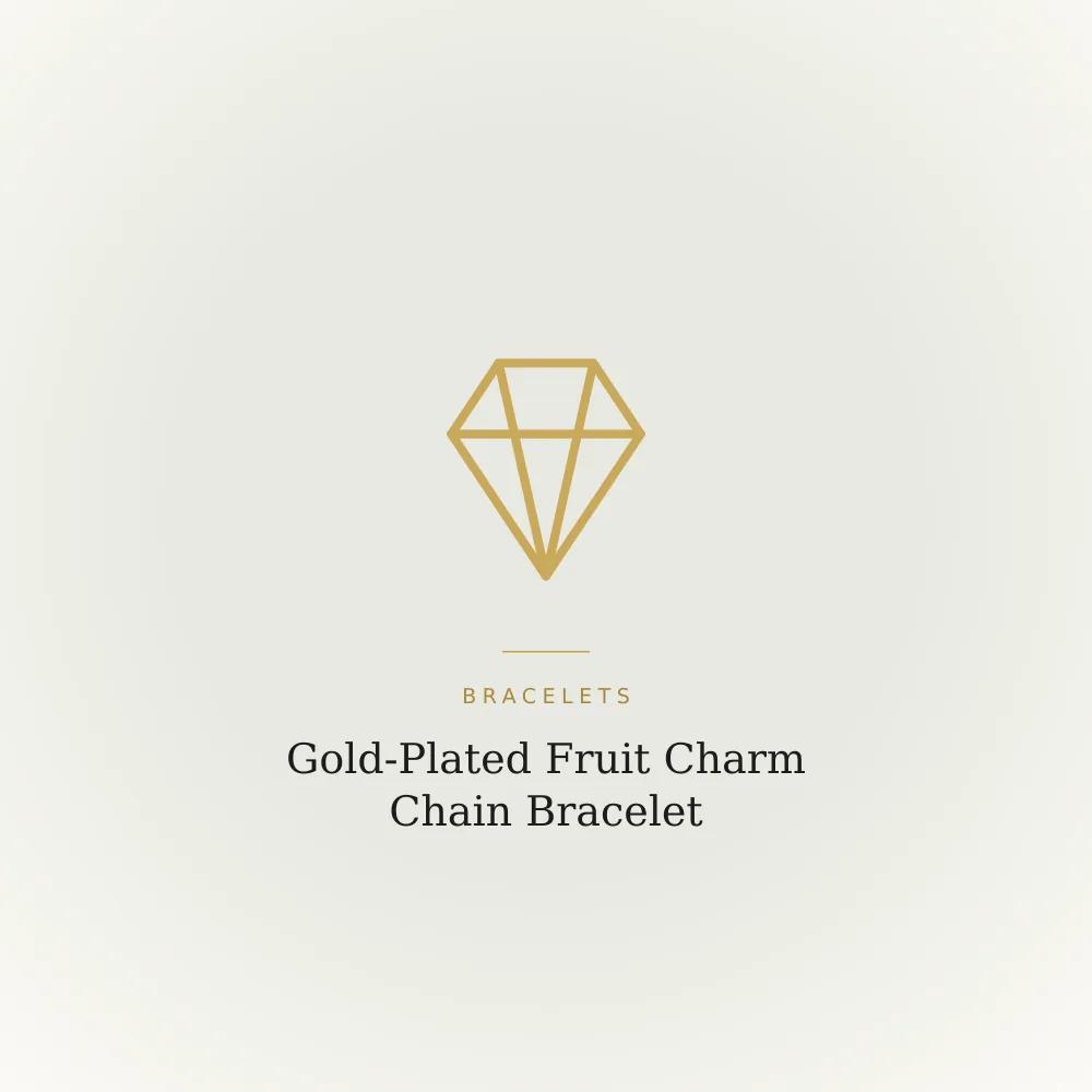 Gold-plated chain bracelet with enamel fruit charms including banana and pineapple shapes