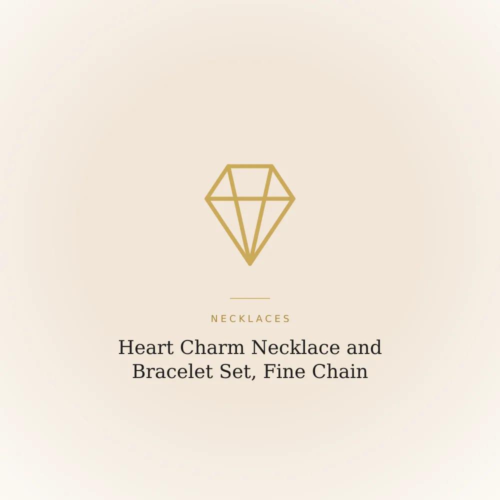 Heart charm necklace and matching bracelet set on a fine golden chain