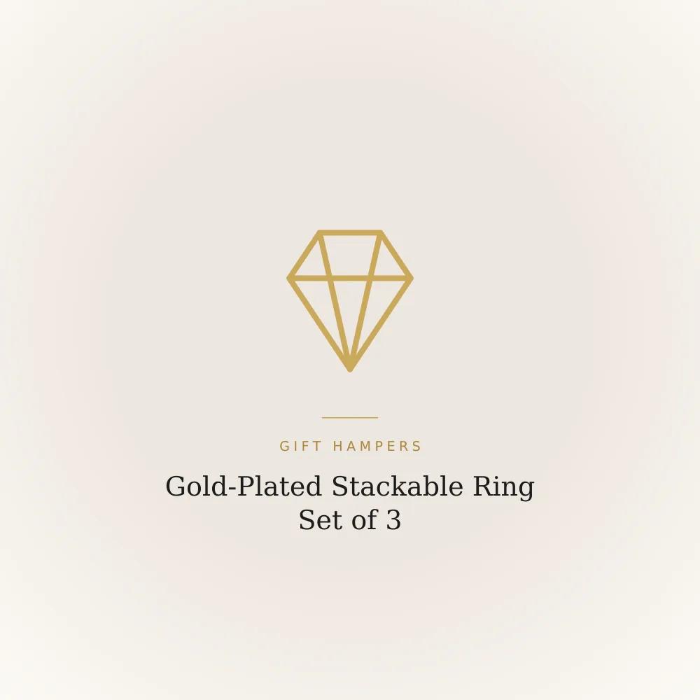 Set of three gold-plated stackable finger rings shown together