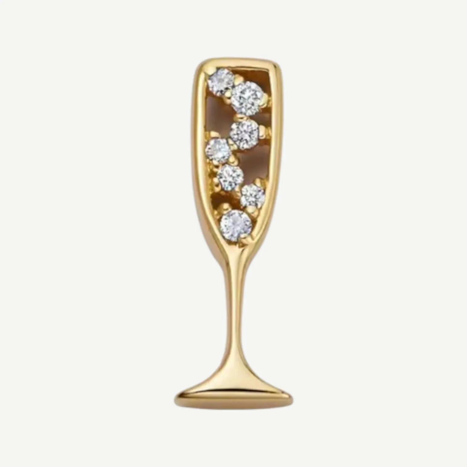 Gold-tone stemmed glass charm with small clear stones set inside the bowl like bubbles