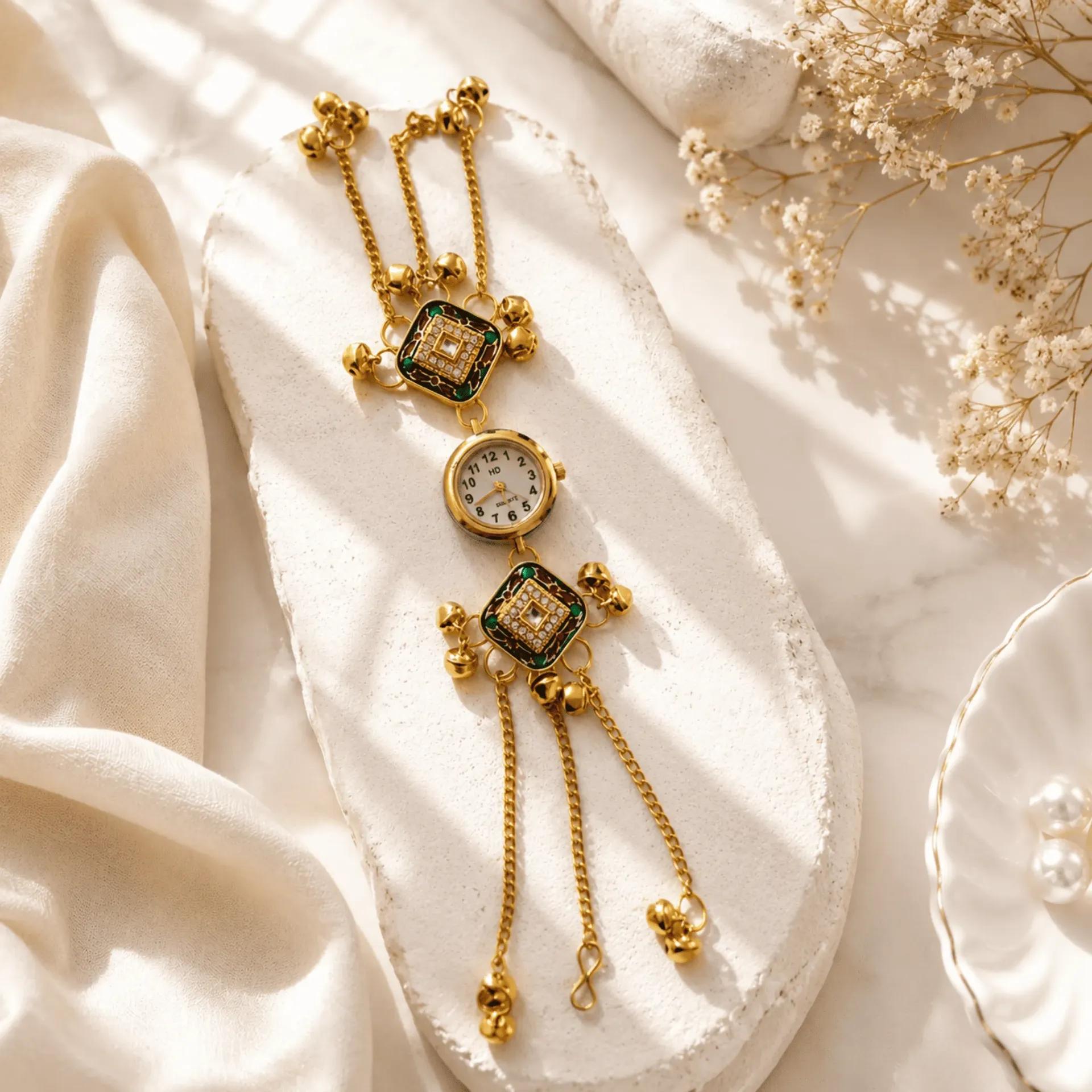 Gold-tone bracelet watch with dark green meenakari square panels and cubic zirconia stones