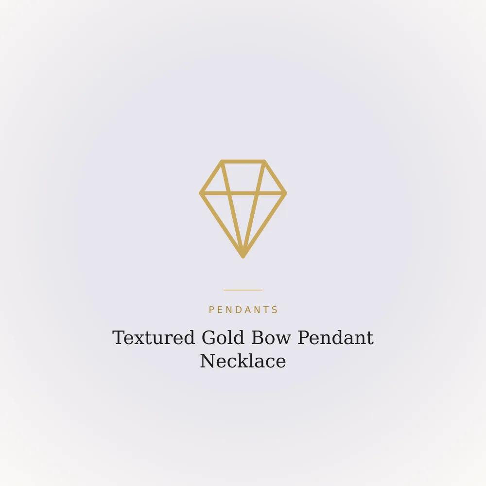 Textured gold-toned bow pendant on a twisted chain necklace