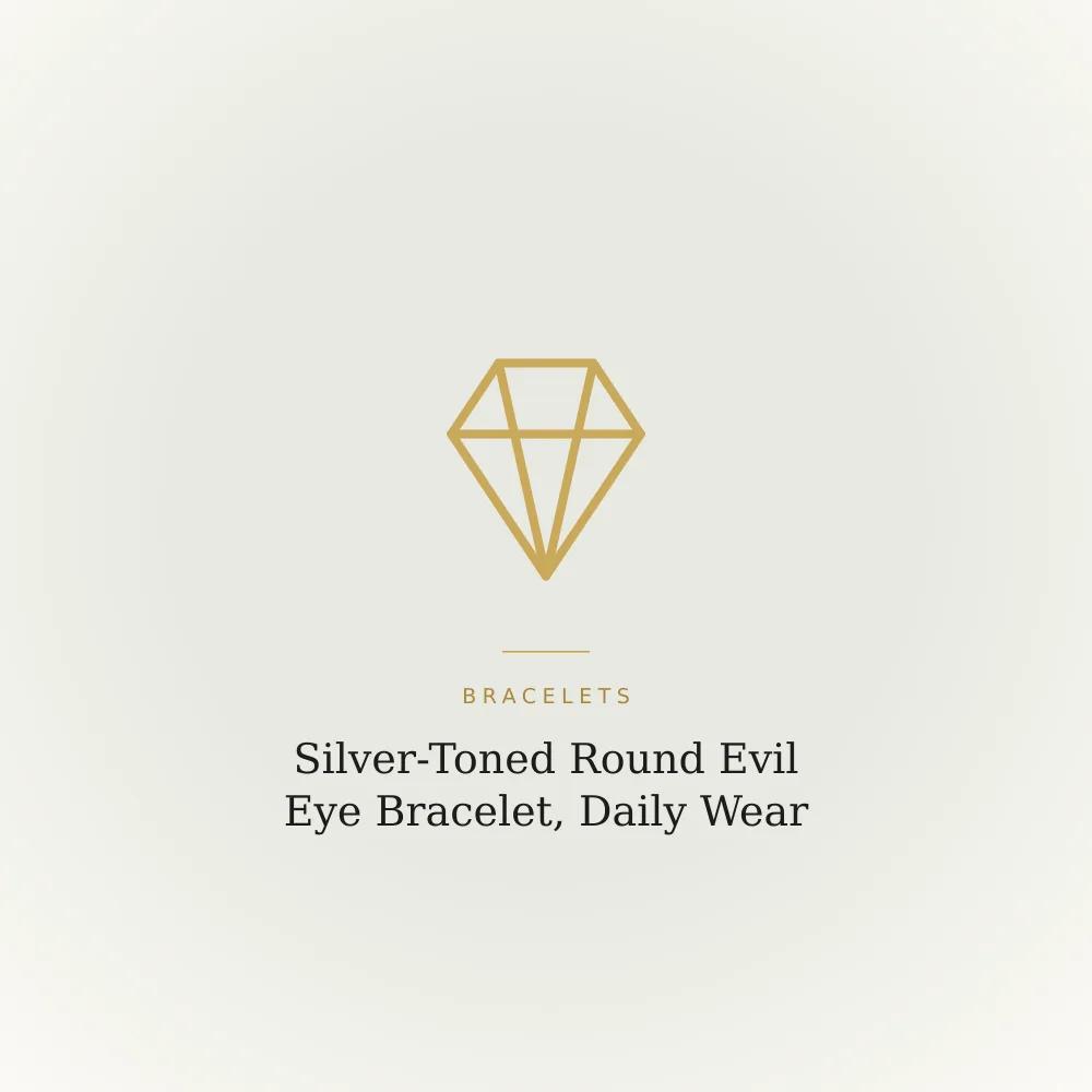 Silver-toned bracelet with a round evil eye charm, shown against a plain background