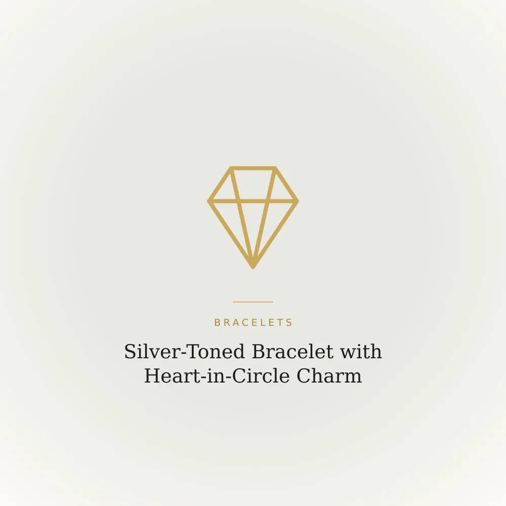 Silver-toned bracelet with a heart-in-circle charm and crystal-look detailing