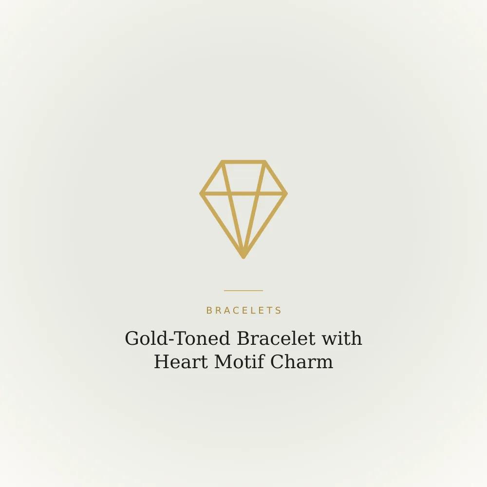 Gold-toned bracelet with a plain heart motif charm and crystal-look stones