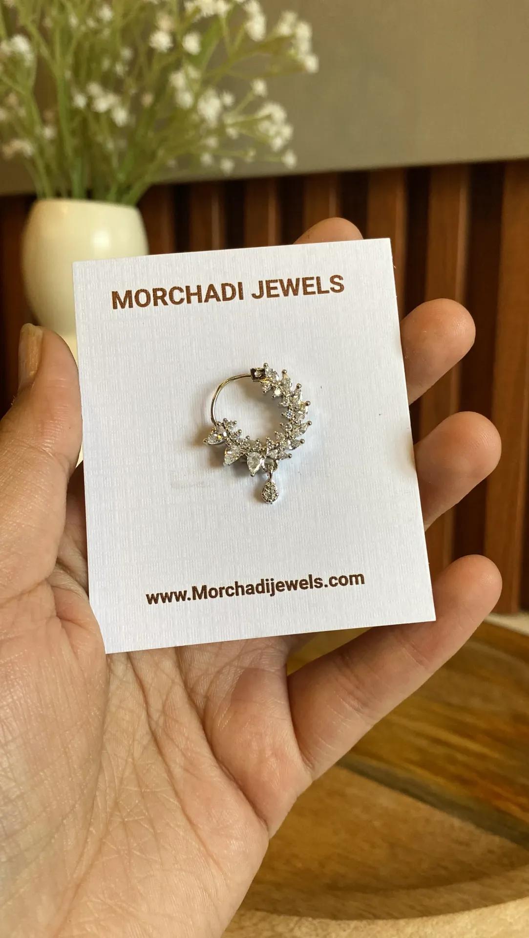 Silver-toned nath set with marquise and pear white zirconia in a leafy crescent with a small stone drop, on a card