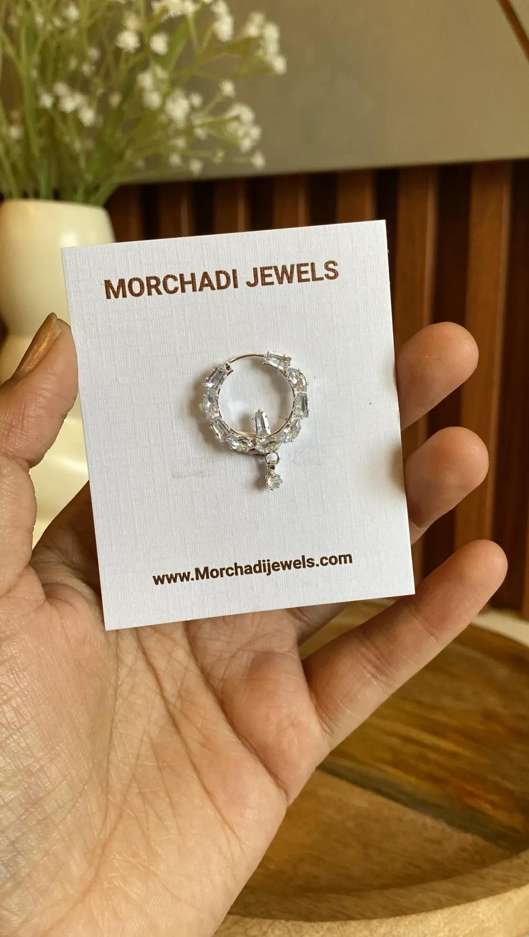 Silver-toned nath with alternating baguette and round cubic zirconia stones and a double stone drop