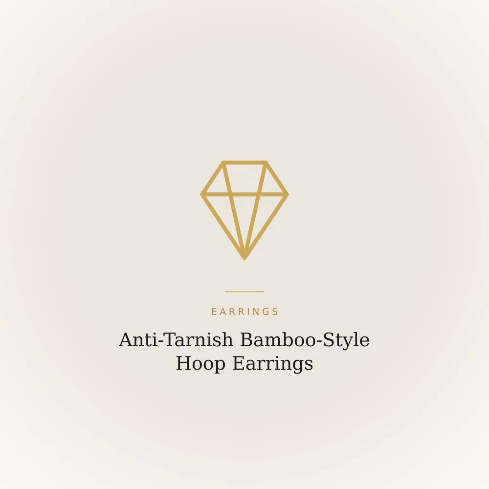 Gold-toned stainless steel hoop earrings with a bamboo-inspired segmented texture