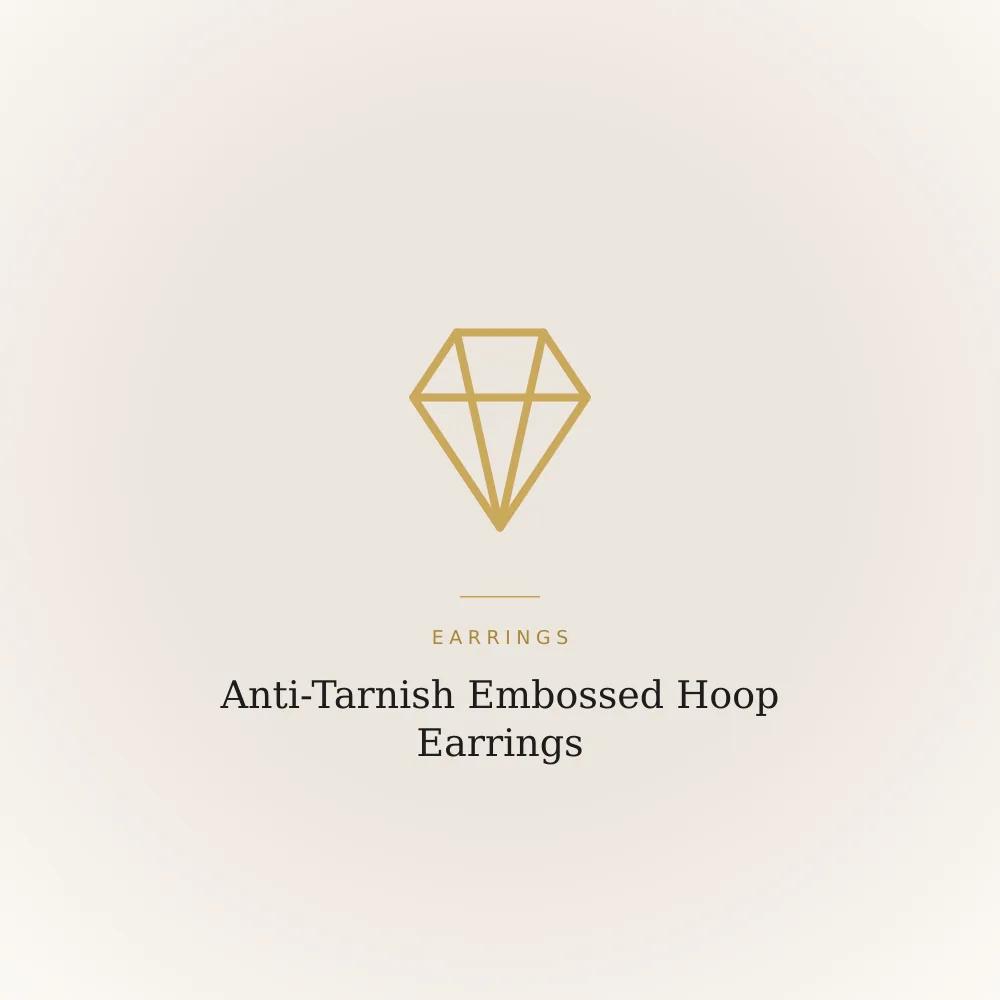 Gold-toned stainless steel hoop earrings with an embossed raised pattern
