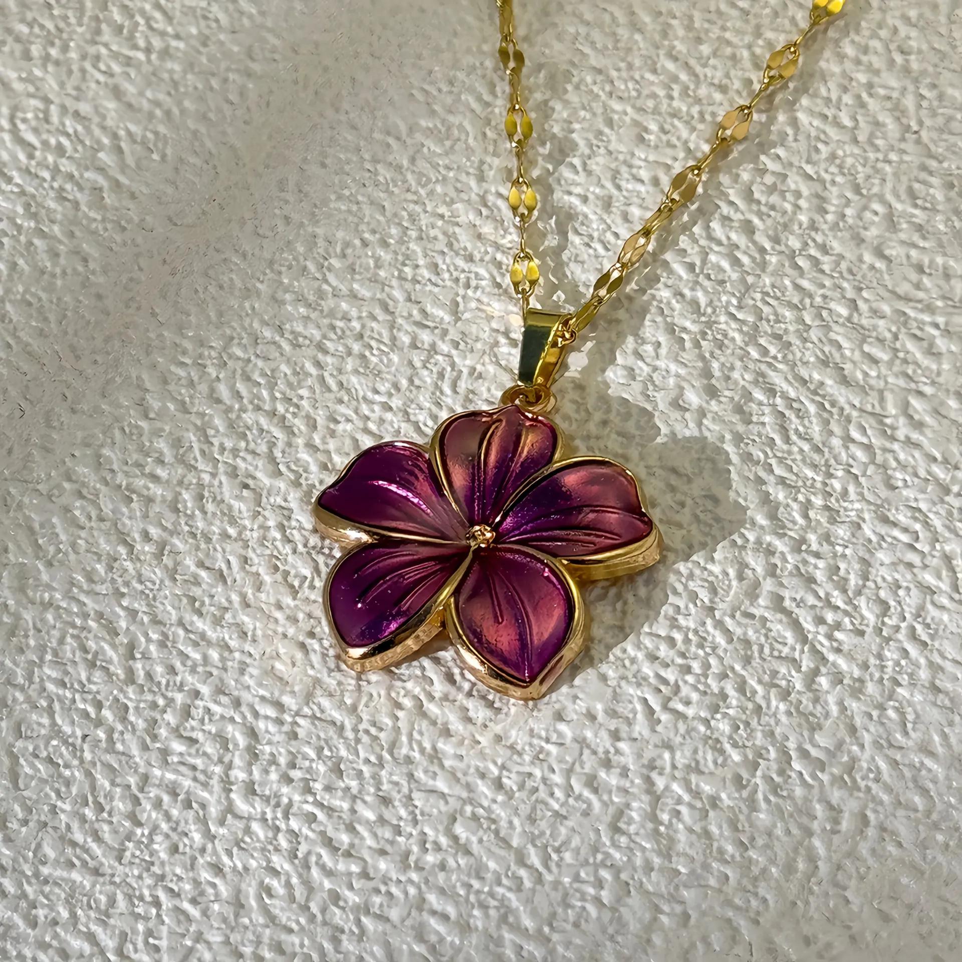 Gold-toned necklace with a five-petal purple gradient enamel flower pendant
