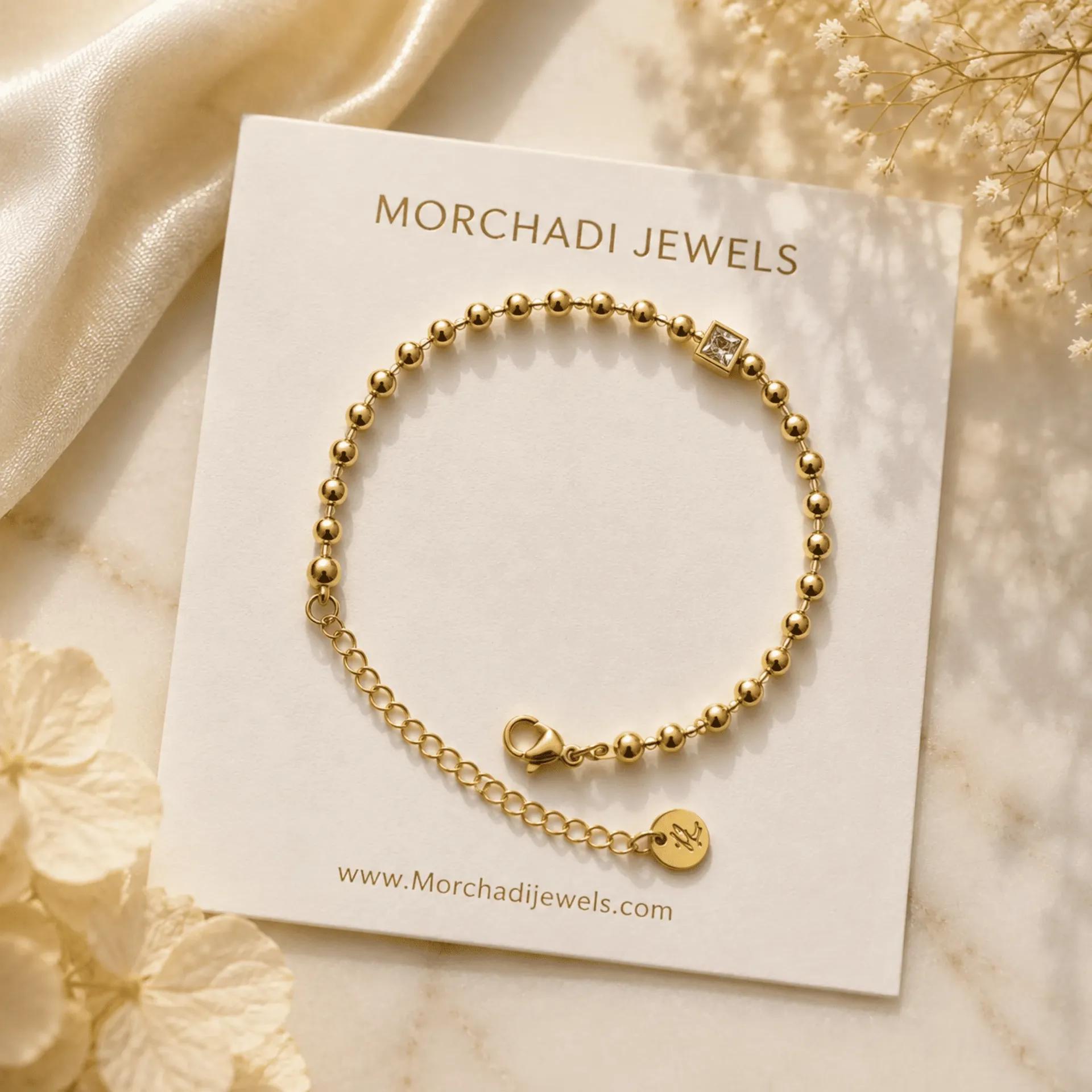 Anti-tarnish gold bead bracelet with a single square cubic zirconia stone and lobster clasp