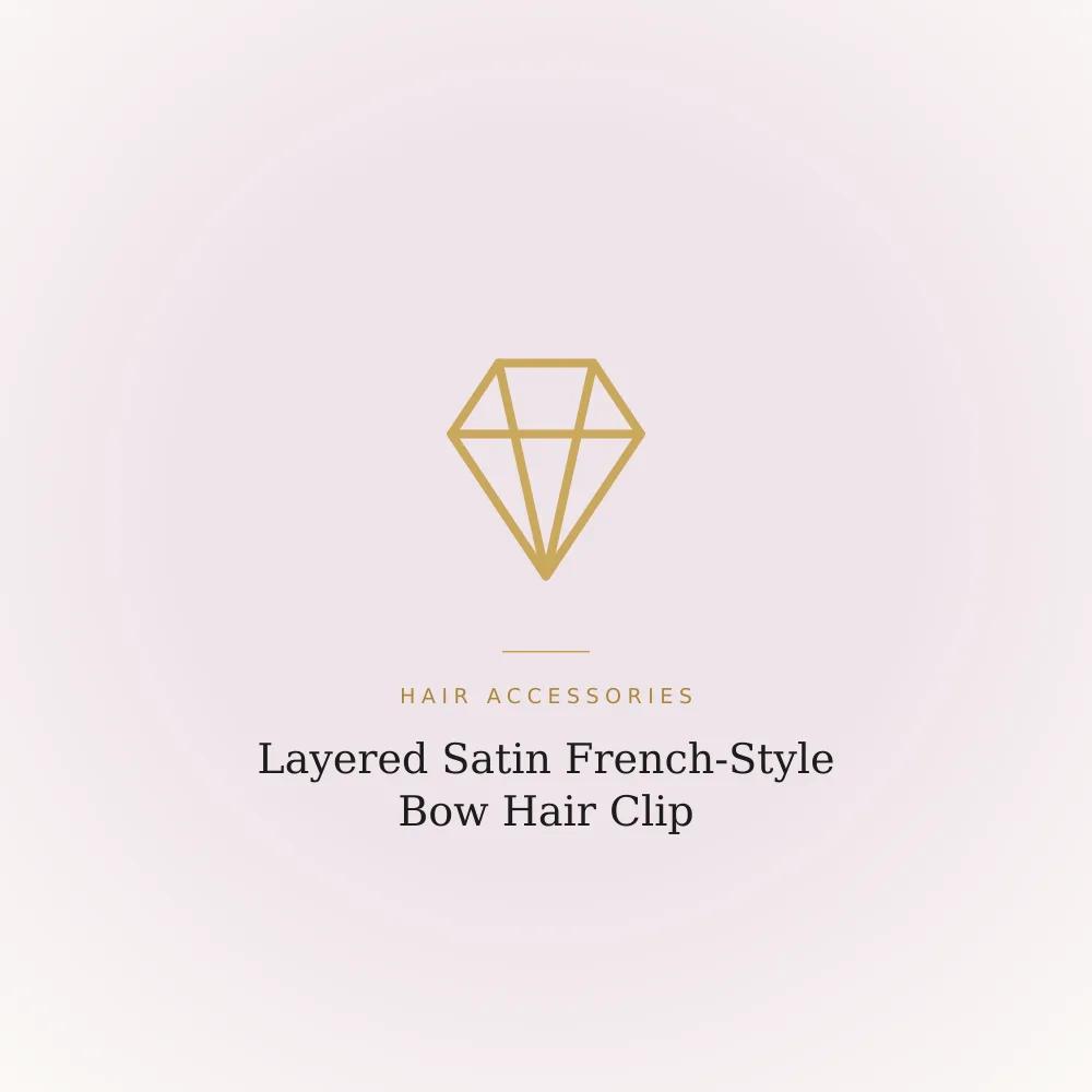 Layered satin French-style bow hair clip with a structured, fuller shape