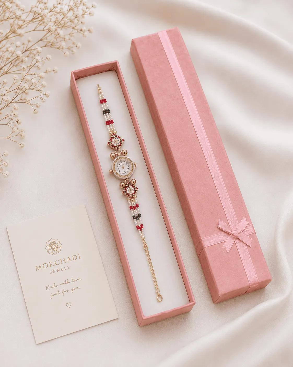 Pearl bead bracelet watch with meenakari-style enamel charms in pink and green