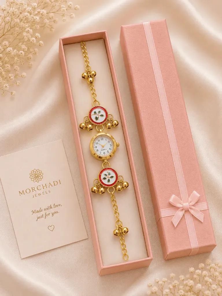 Round quartz dial between two meenakari enamel discs on a chain hung with ghungroo bells