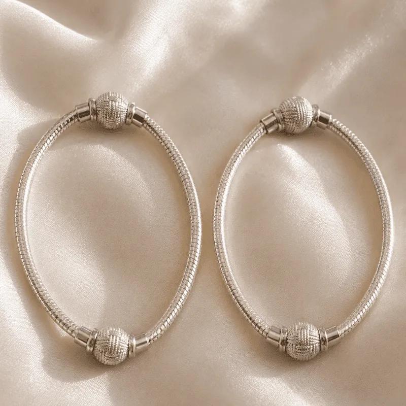 Pair of flat silver-plated snake chain anklets, each with two small textured ball beads