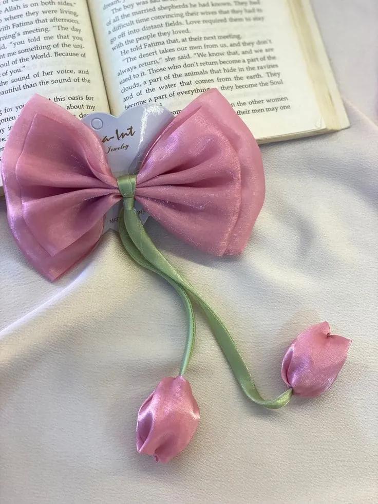Organza bow hair clip in pink with two satin tulips on green ribbon stems