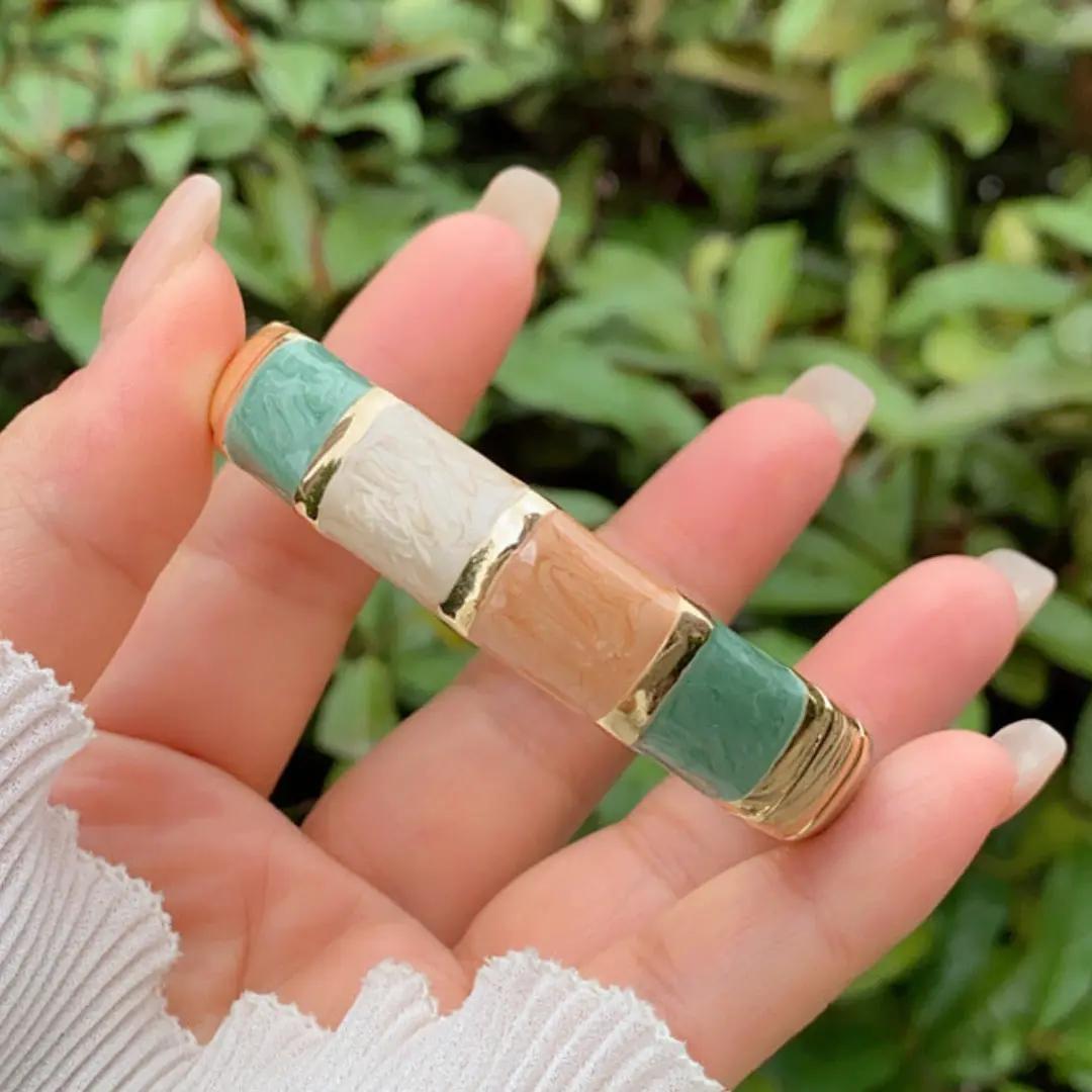 Neutral-toned ombre enamel kada in sage, ivory and tan with gold-plated dividers