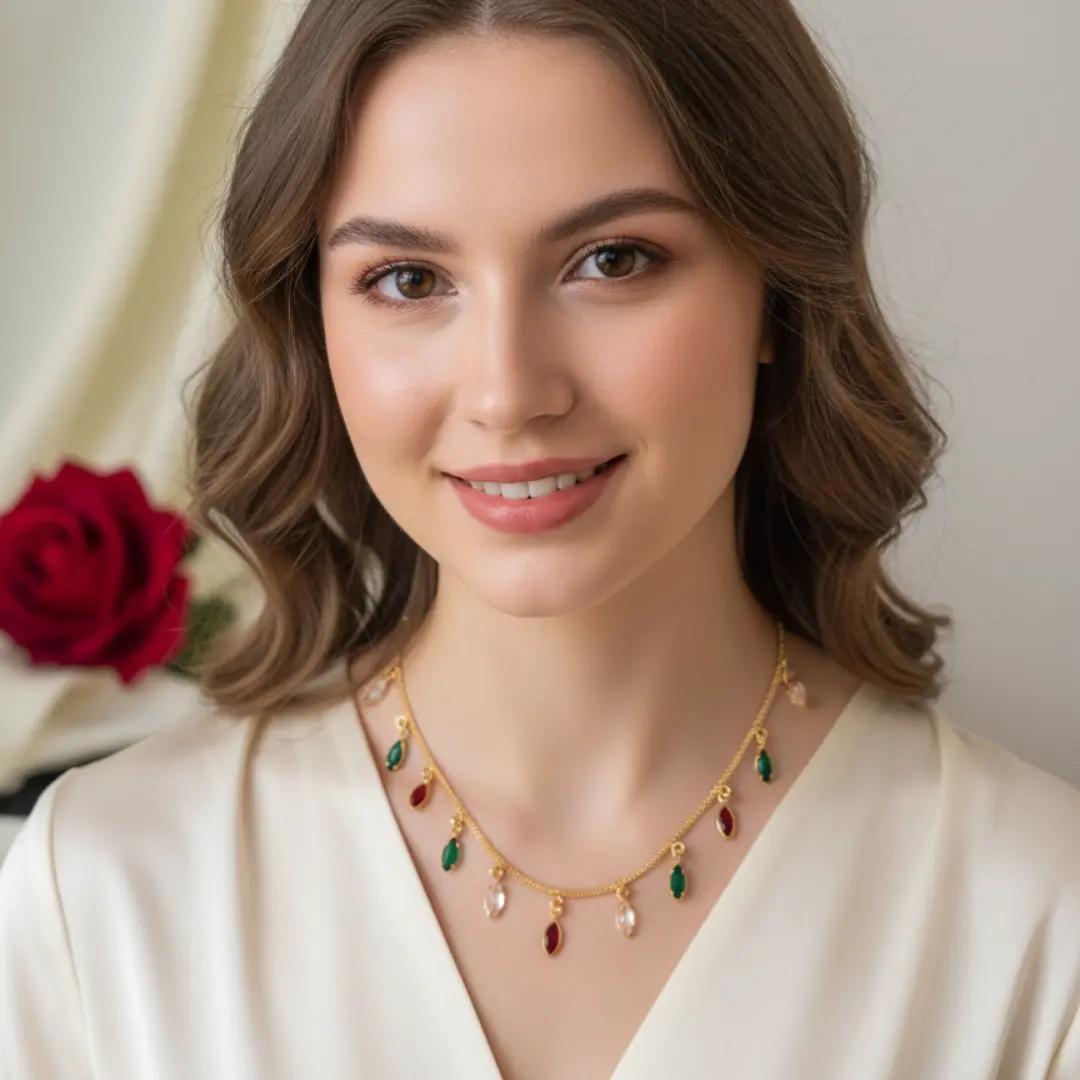 Gold-plated chain necklace with alternating red, green and pearl-look drops