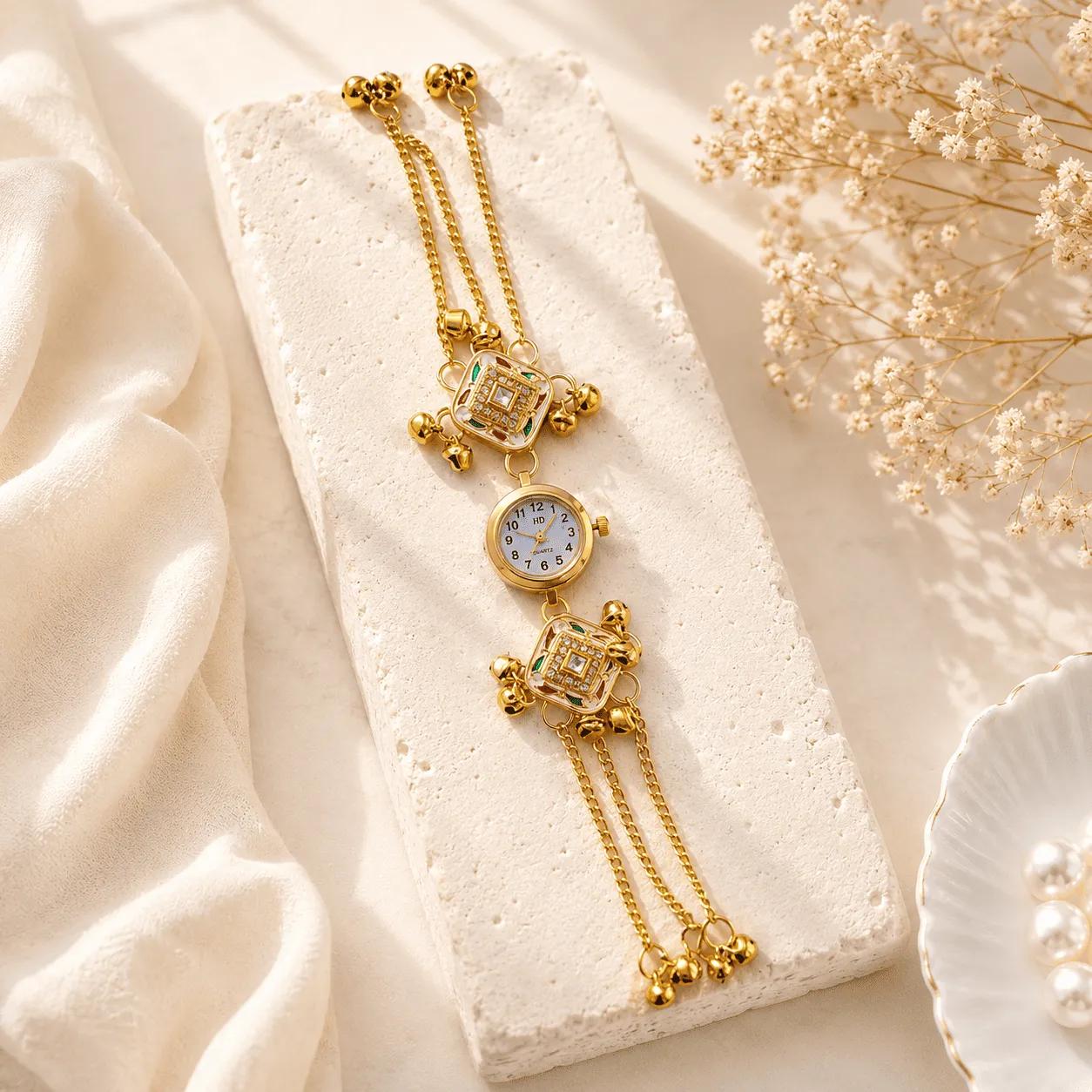 Gold-tone bracelet watch with square green enamel kundan frames and triple chain strap