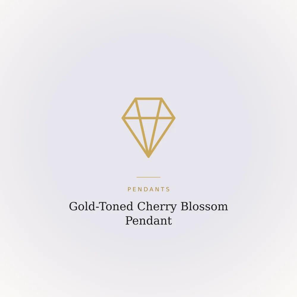 Gold-toned pendant shaped as a cherry blossom with pink petal detailing
