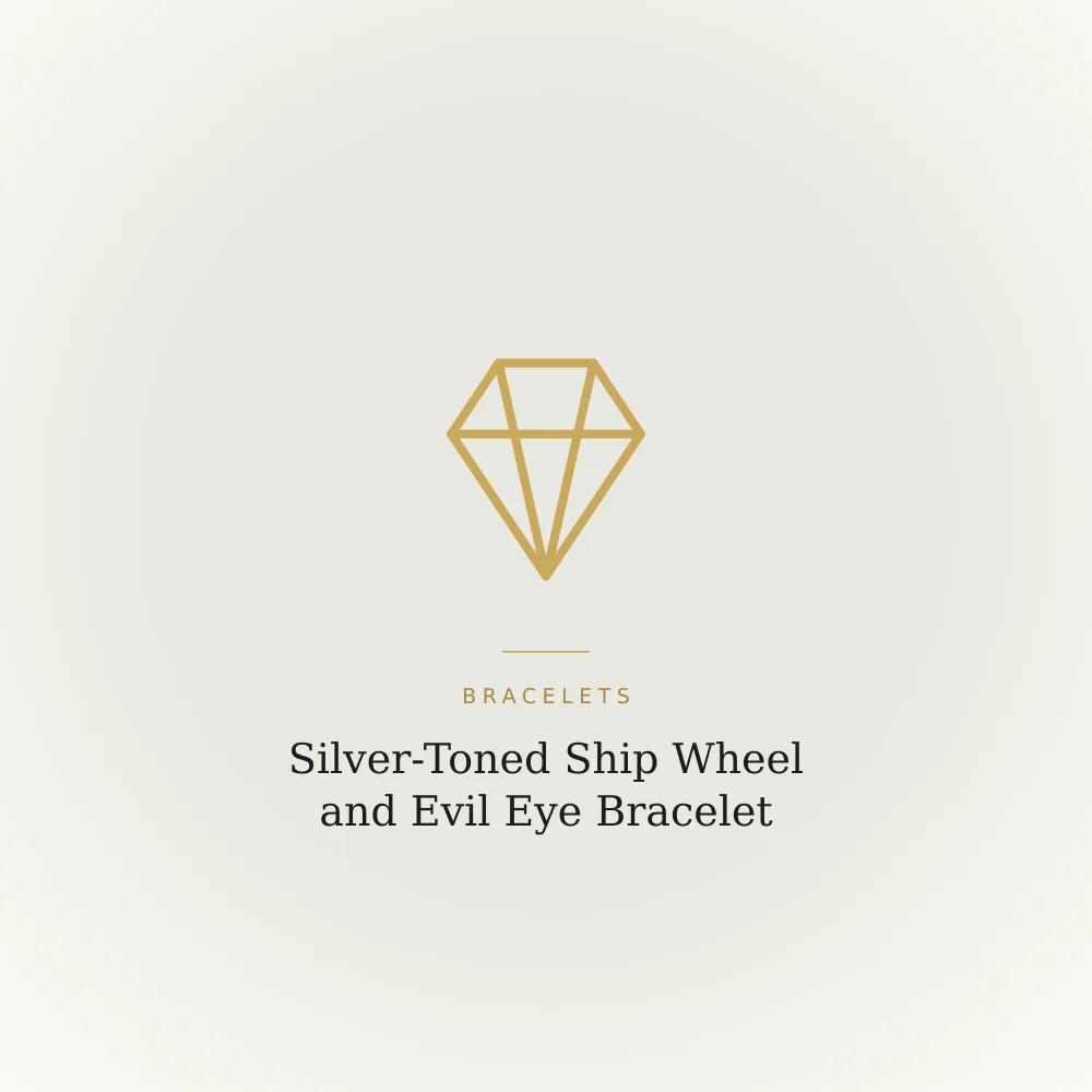Silver-toned bracelet with a ship wheel charm and an evil eye charm