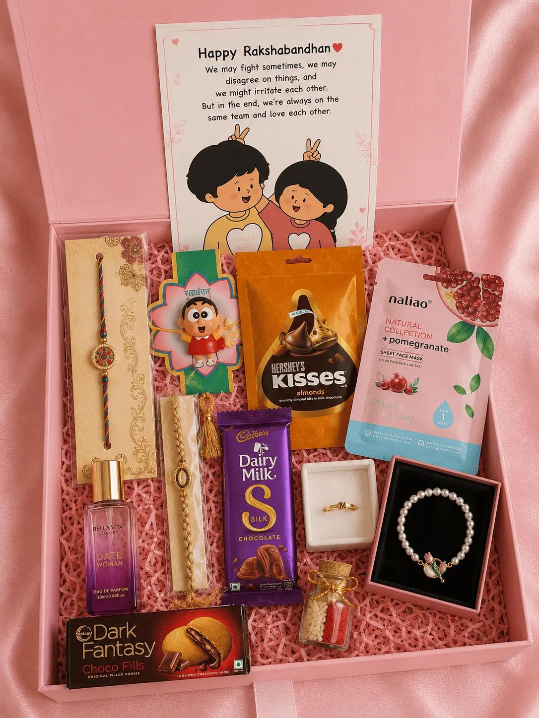 Pink luxury gift box with rakhis, an initial ring and a pearl-look bracelet